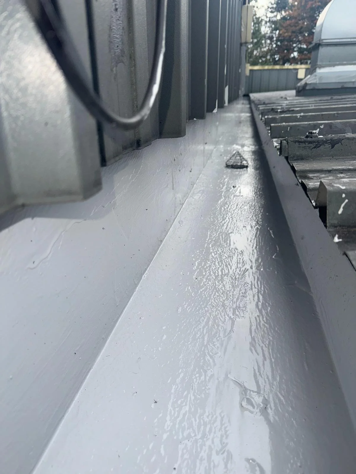 Commercial gutter repaired and waterproofed with Lava 20 in Oldham, Greater Manchester.