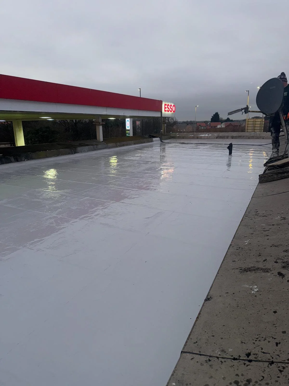 Petrol station shop flat roof refurbished with Lava 20 in Stockport, Greater Manchester.