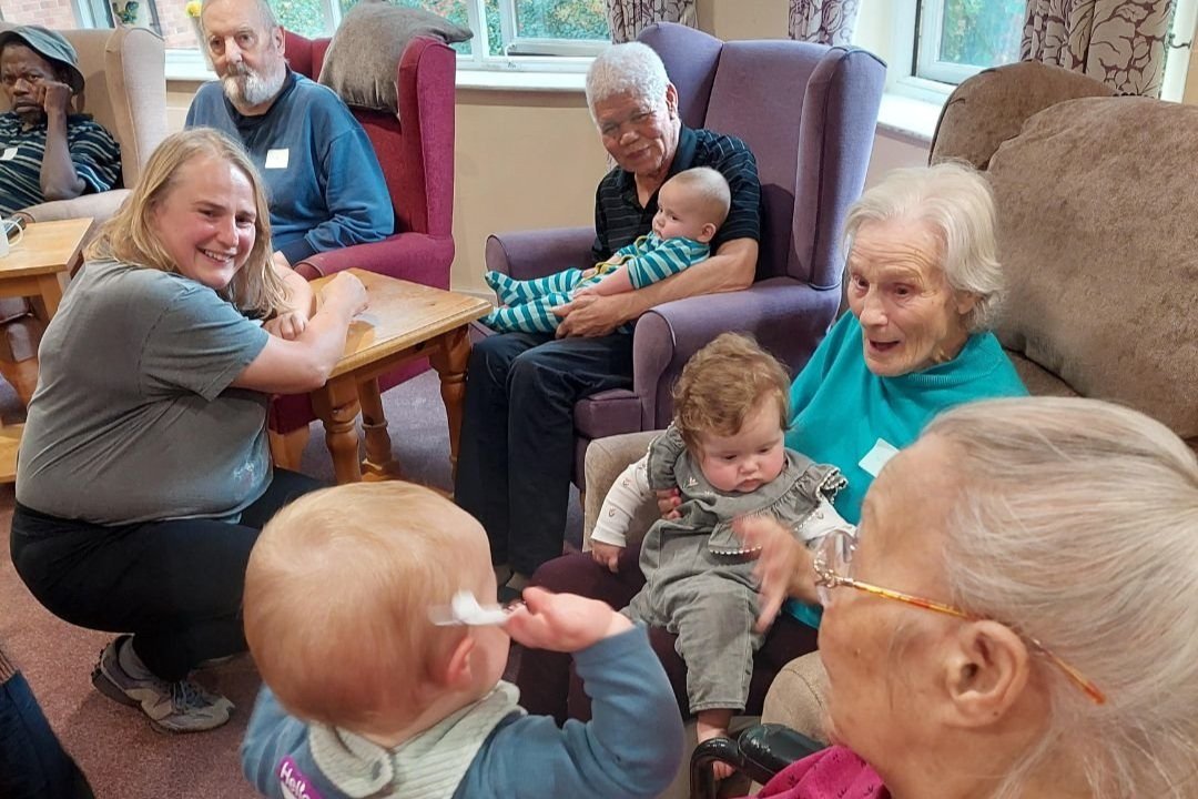 A warm Songs & Smiles moment bringing families and older people together in a supportive space