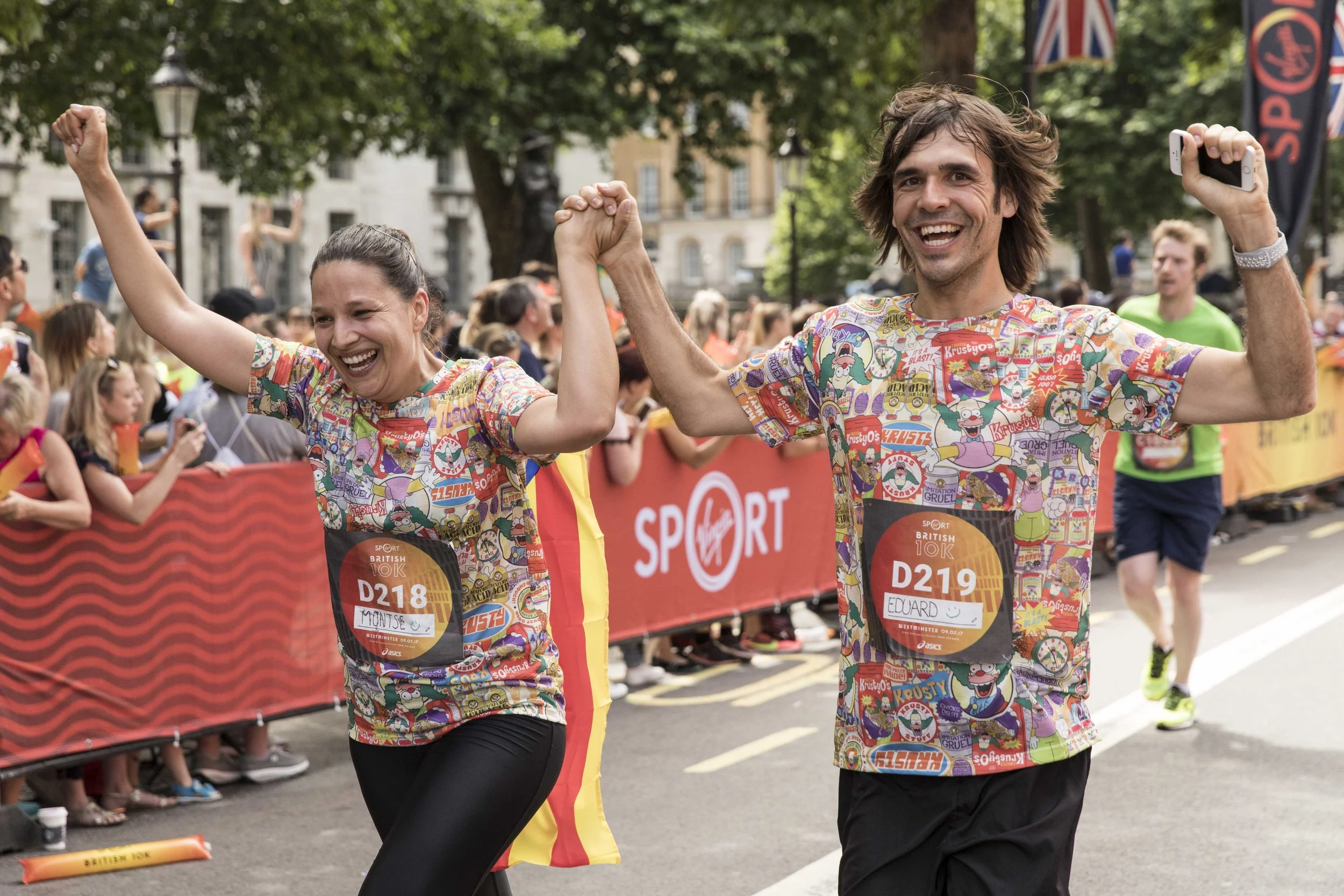 Two runners celebrating during the London 10k