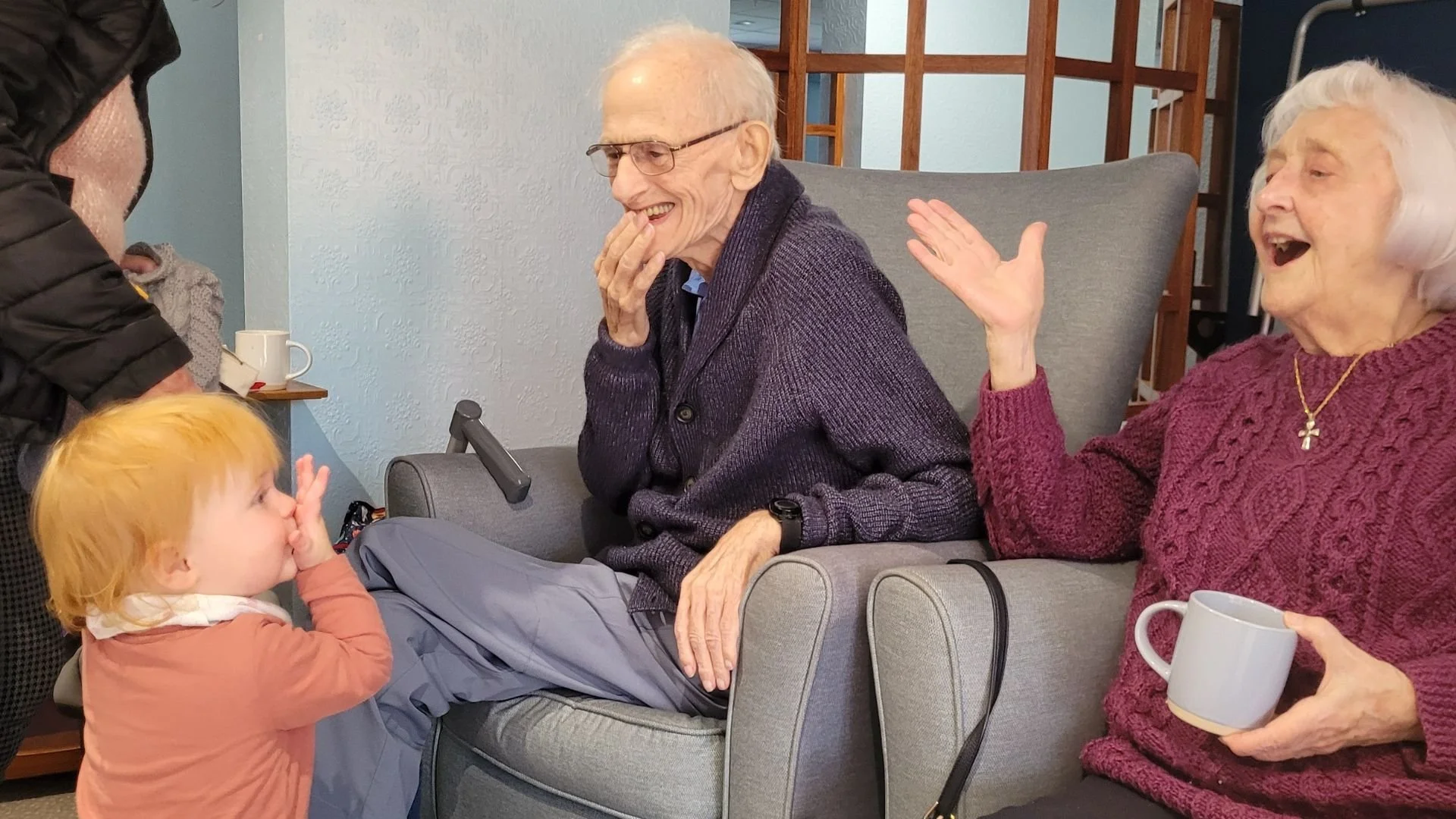 A warm Songs & Smiles moment sharing laughter and connection between generations