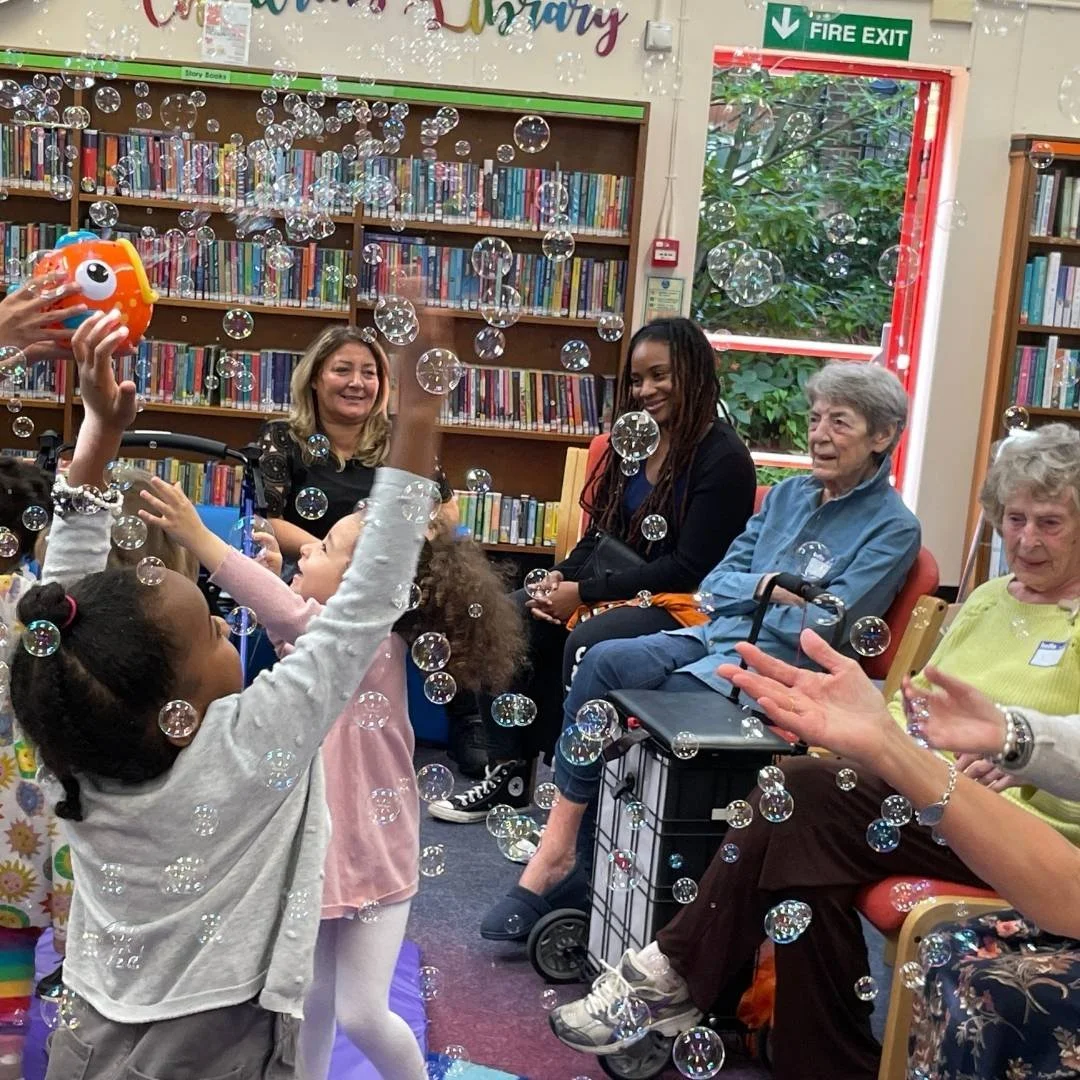 A joyful Songs & Smiles session with bubbles bringing generations together