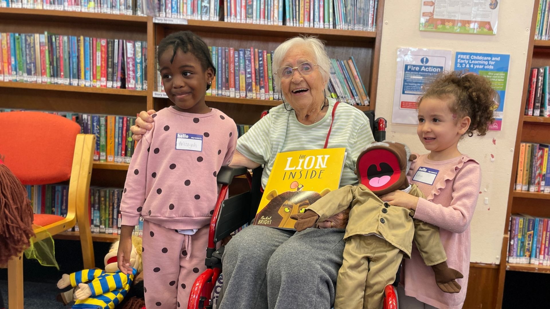 Generations participant sharing a joyful We are Friends session in the library