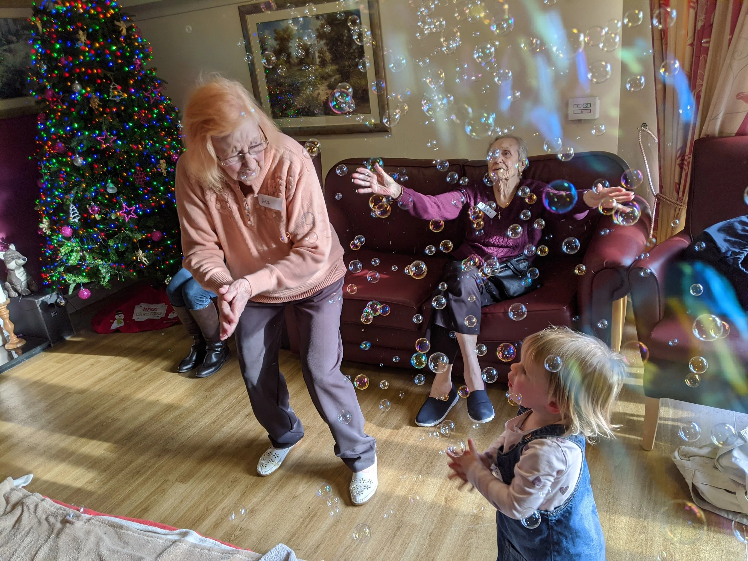 A joyful Songs & Smiles moment with bubbles, movement and shared laughter