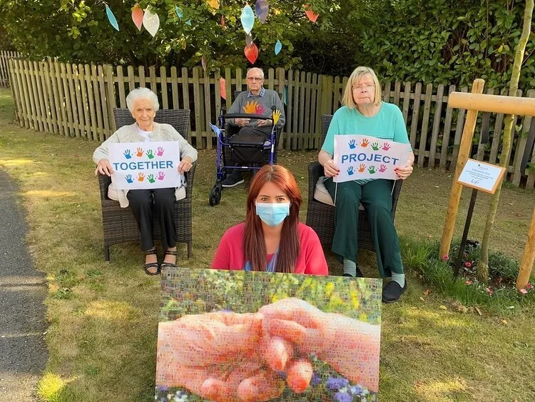 People taking part in The Together Project’s Hand in Hand Together campaign