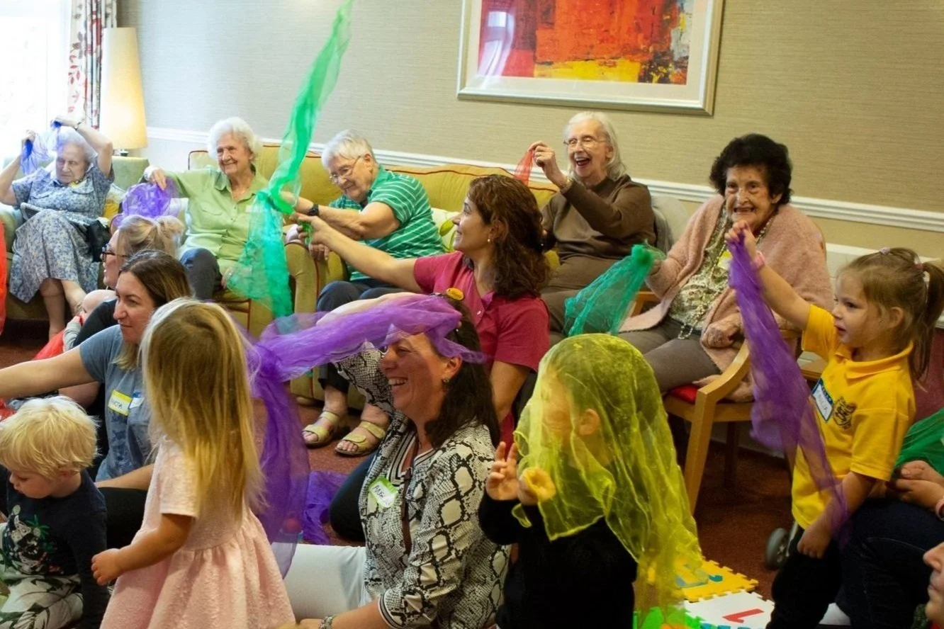 A joyful Songs & Smiles session bringing generations together through music and movement