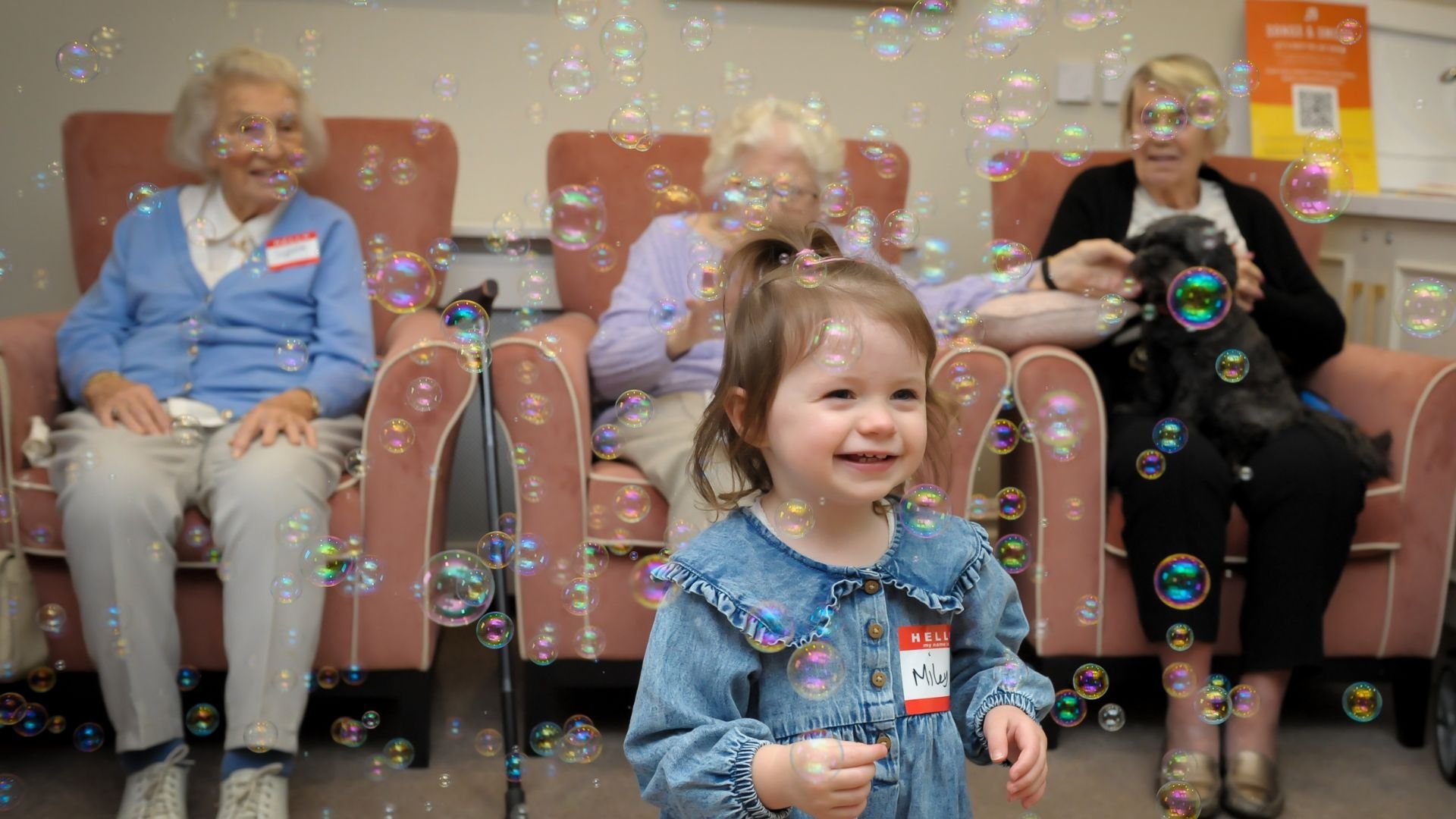 A joyful Songs & Smiles moment with bubbles bringing generations together