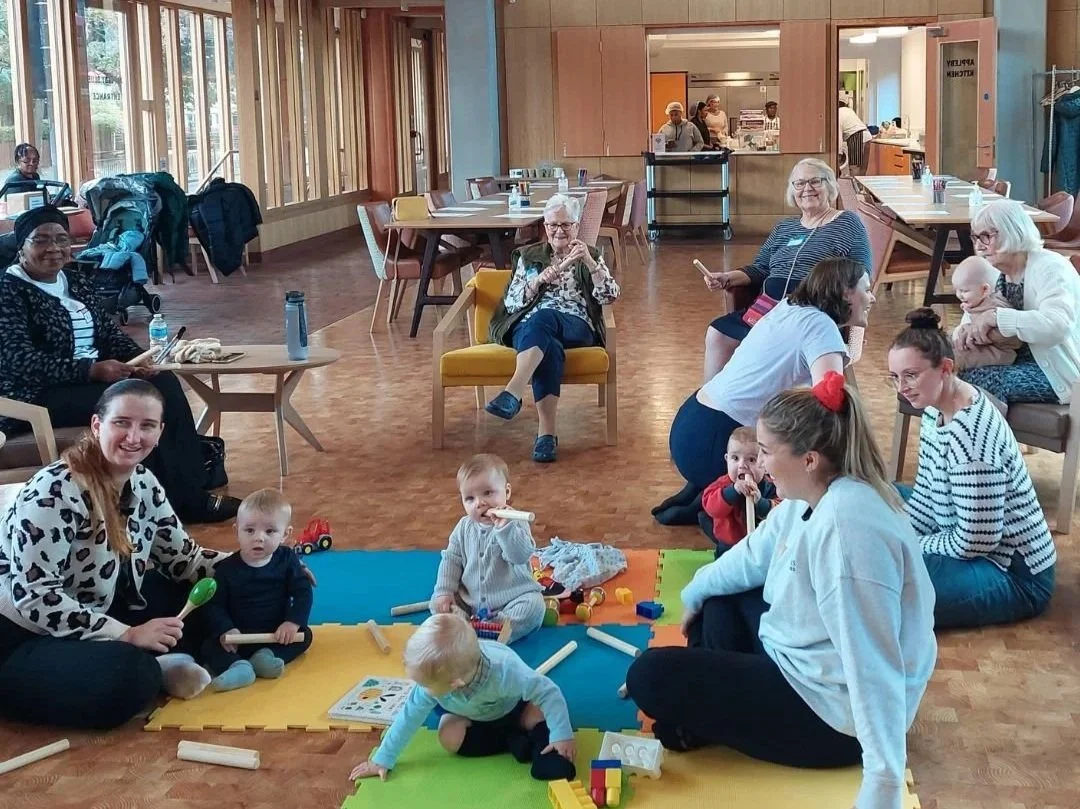 The moment enjoying a Songs & Smiles session together at Appleby Blue Almshouse