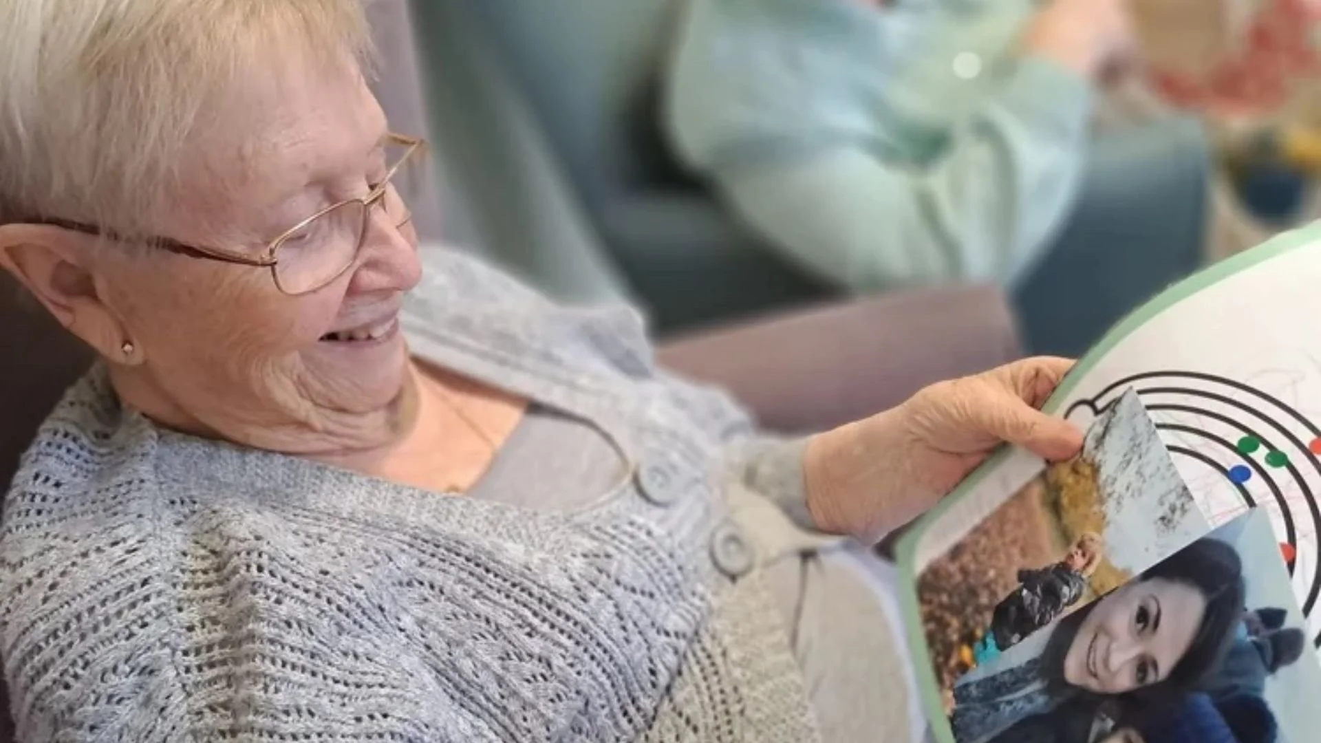 The Together Project Crafting Connections care home resident reading post