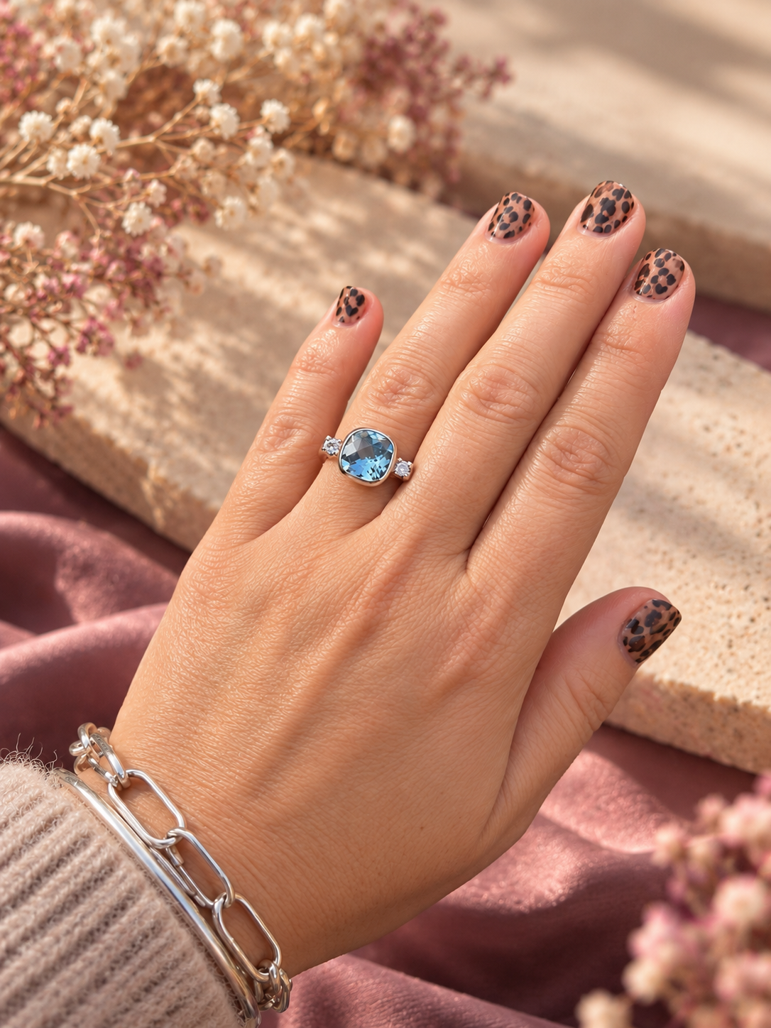 Elegant Blue Gemstone Ring Close-Up.png