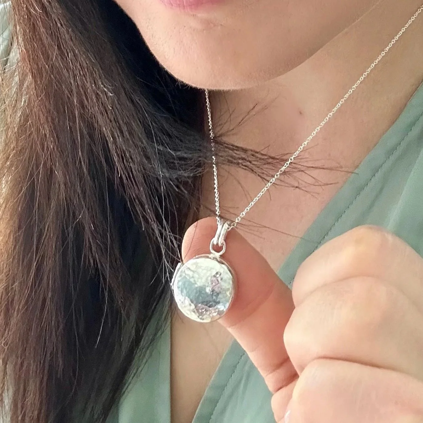 The Locket - a hinged locket with a hidden compartment