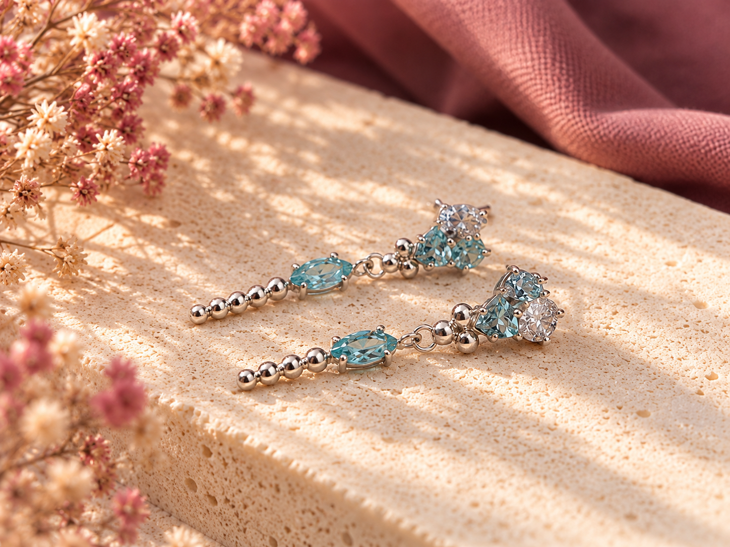Aquamarine Silver Earrings on Stone.png