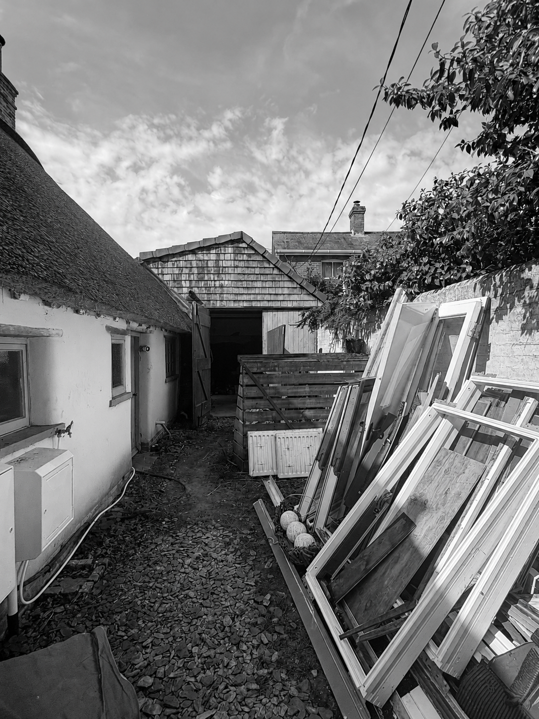 New Forest cob cottage construction project. Demolition to existing garage. Pell-Stevens Architects.