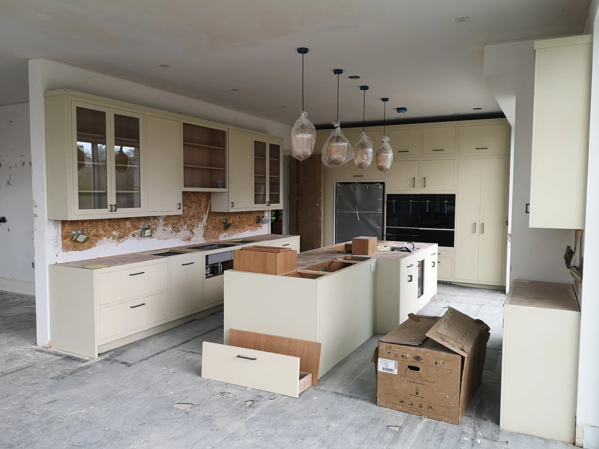 Pell Stevens Architects West Sussex countryside home. New contemporary kitchen with island. full height units. Interior design.