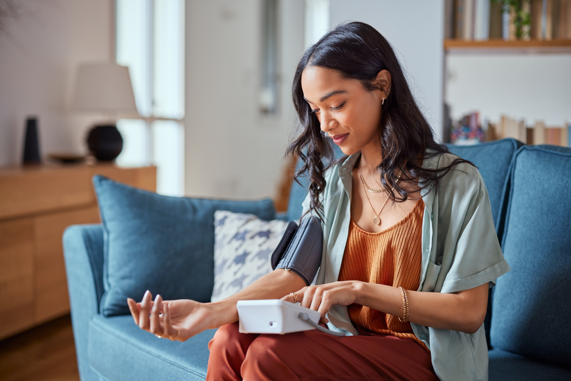 Woman Checking Her Own Blood Pressure