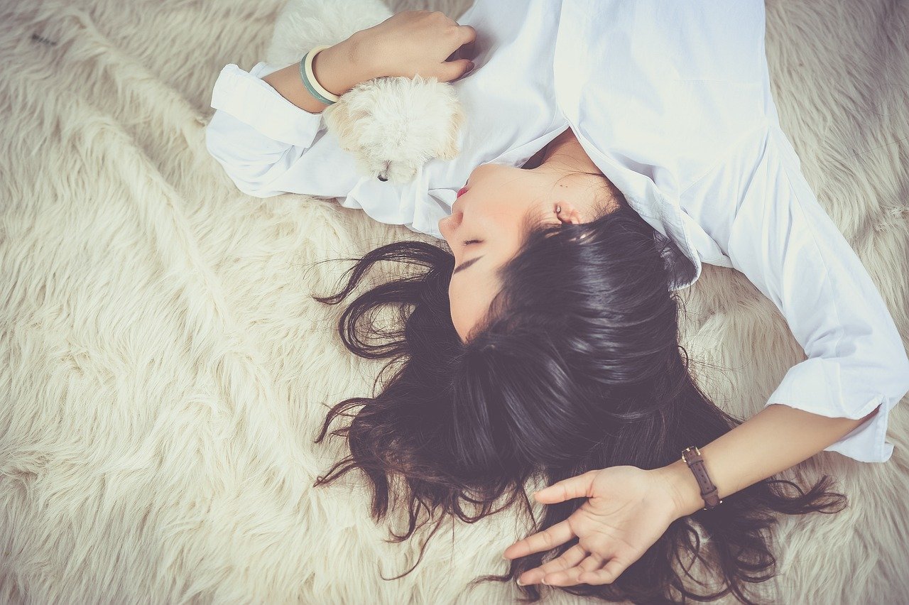 Woman Sleeping With Dog