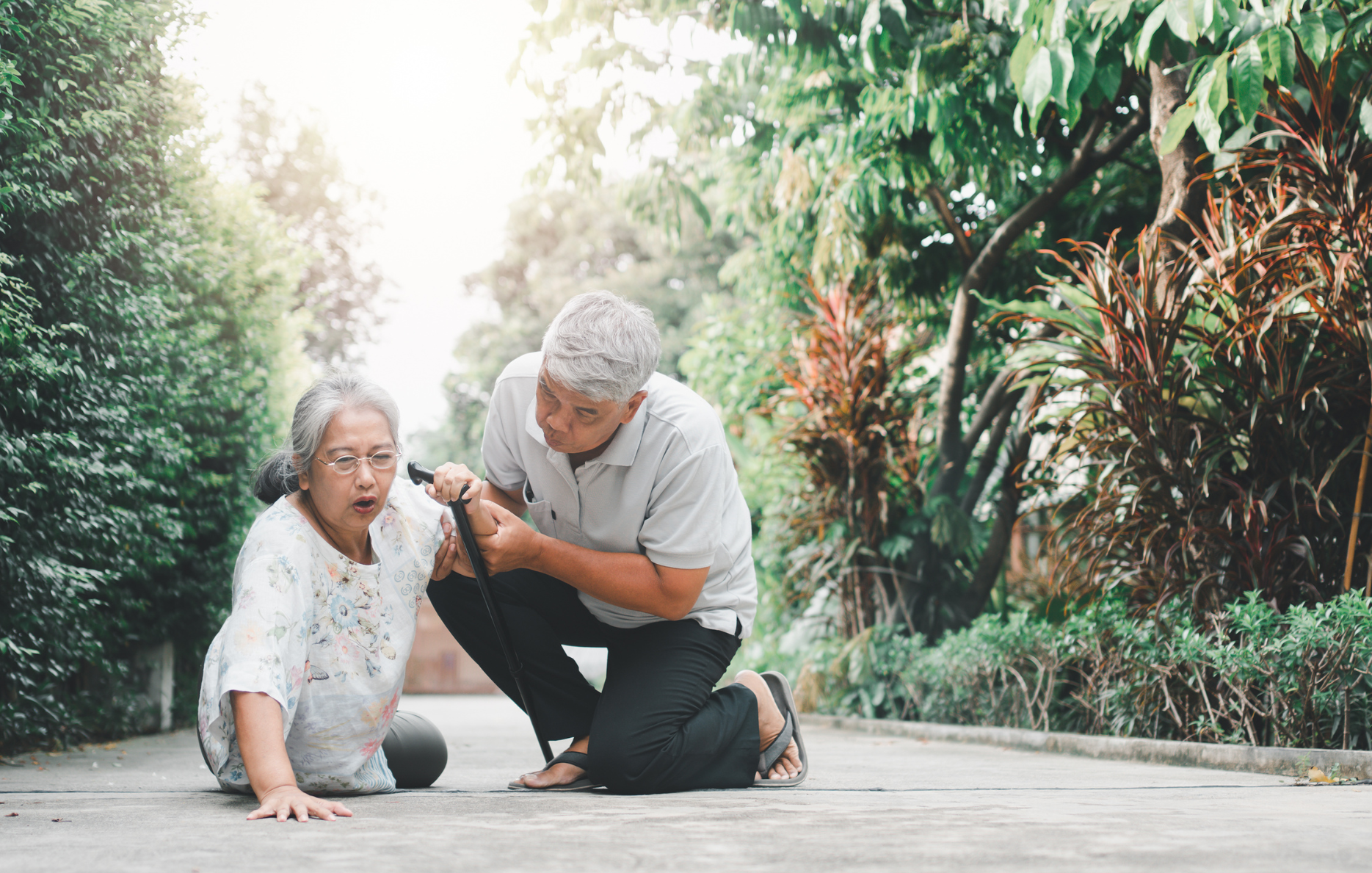 Man Helping Woman Who Has Fallen