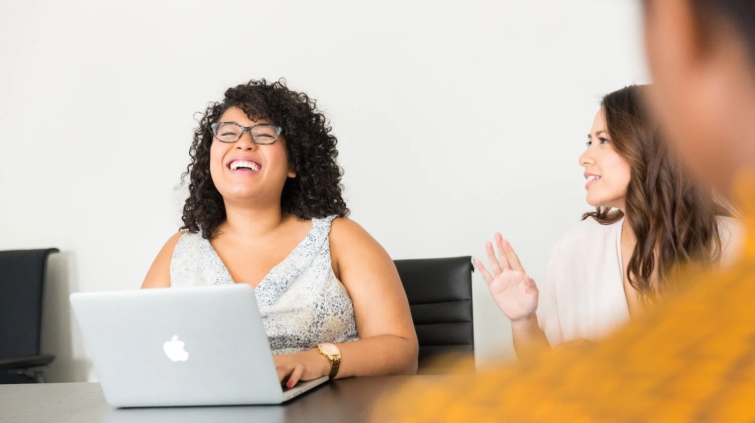 2WomenLaughingTable.jpg