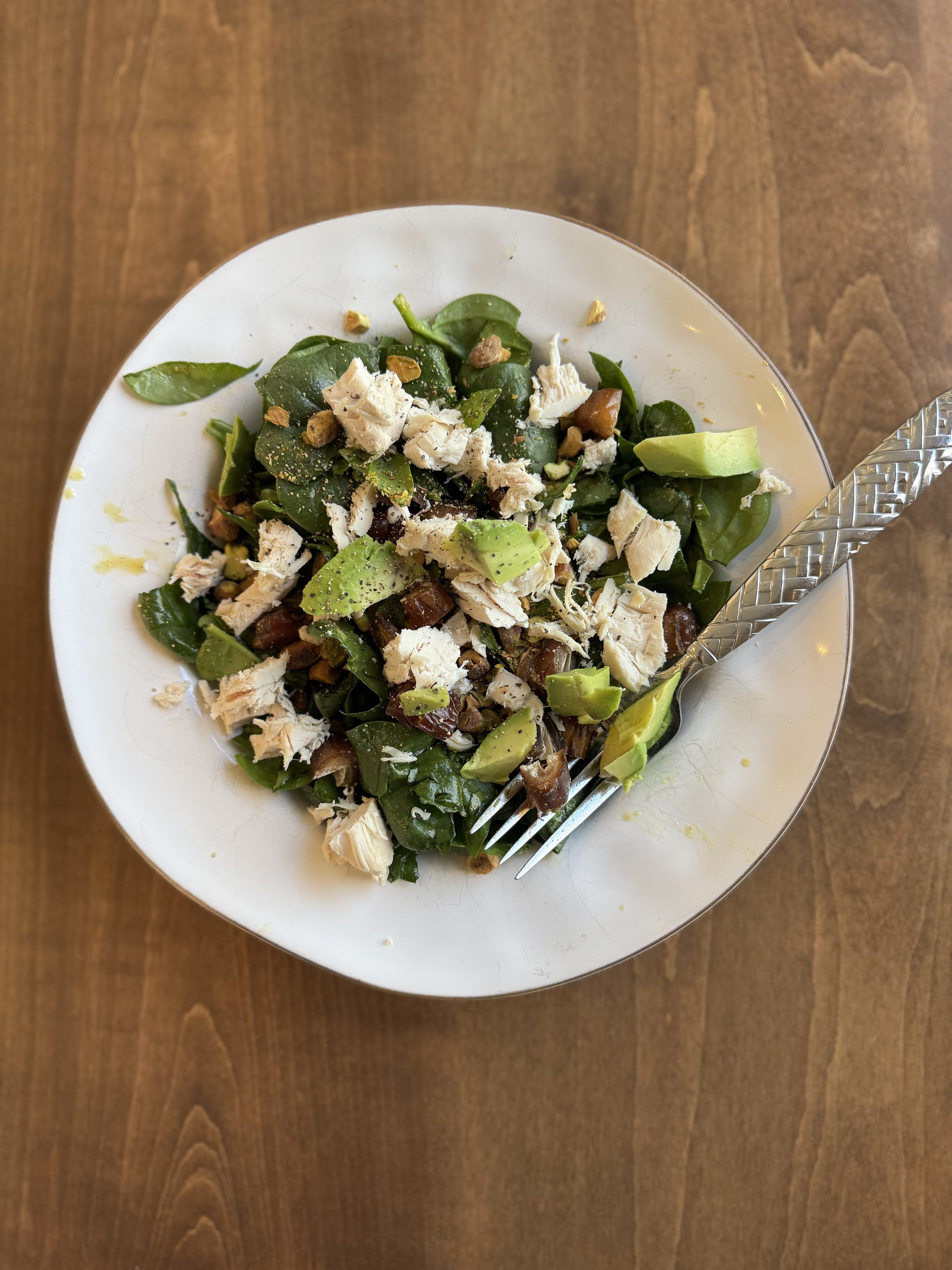 Spinach salad with pistachios, medjool dates, avocado and ginger-lemon vinaigrette