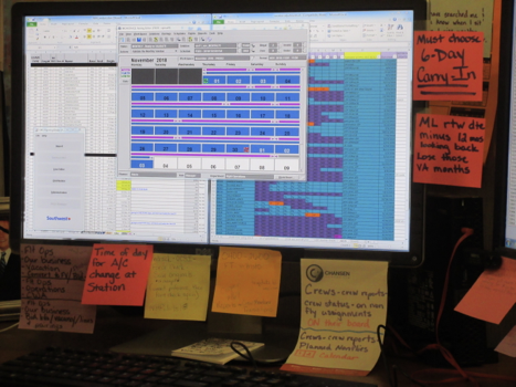 The old system, surrounded by post-its to help this Planner remember dozens of work arounds and manual processes.
