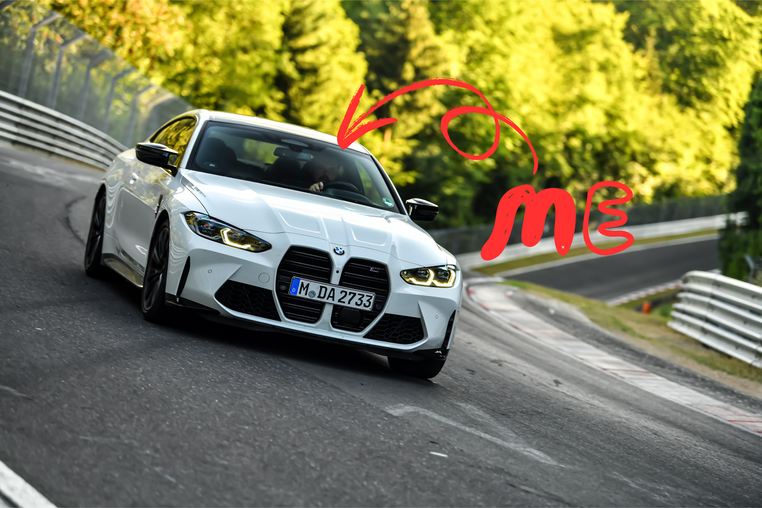 White BMW car on a race track with a "me" annotation pointing to the driver inside.