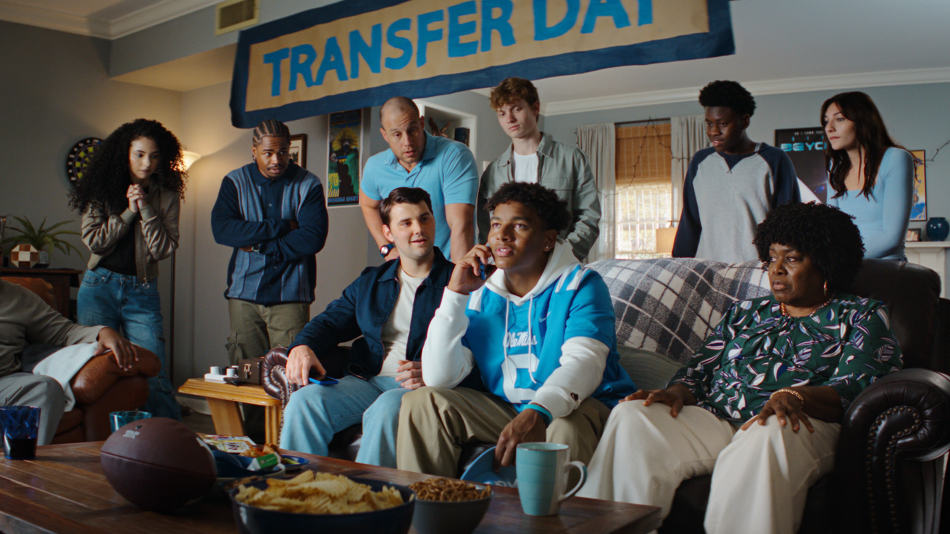 Friends and family watch Transfer Day together at home