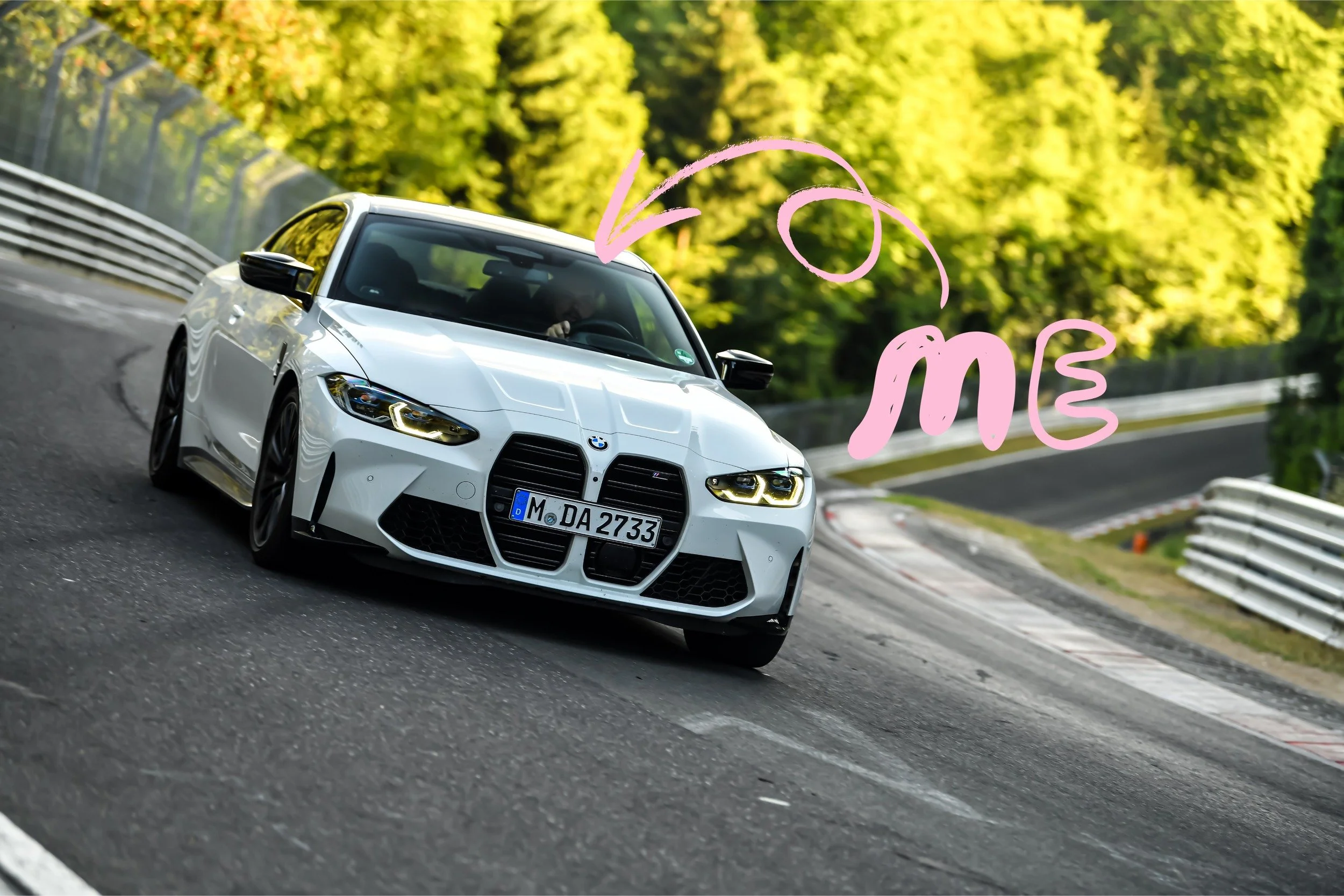 Matt Epstein driving a white BMW on the Nürburgring, with a handwritten me pointing to him