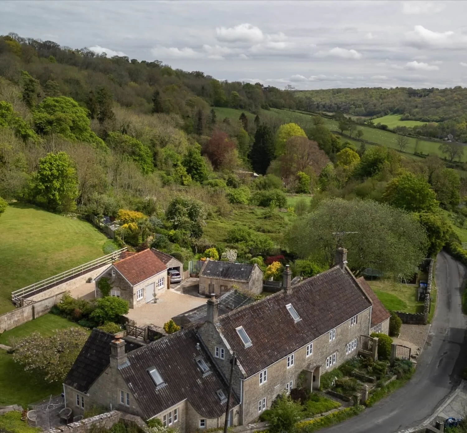 Aerial view of The Old Workshop holiday cottage and the farmhouse in Monkton Combe, near Bath