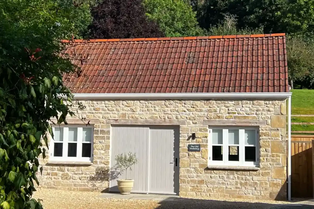 Self‑catering holiday cottage in Monkton Combe near Bath — The Old Workshop, Monkton Combe front of stone cottage