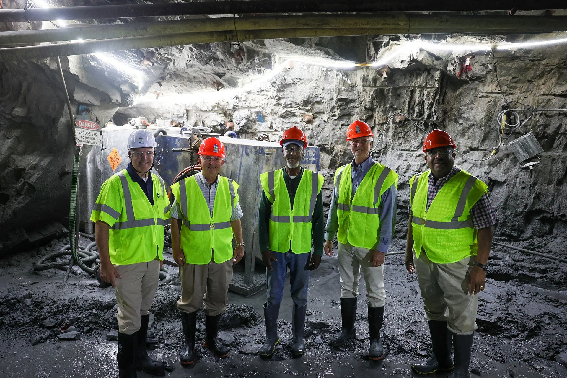 Local leaders pose for a photo inside the Blackwater CSO Tunnel's excavated path.