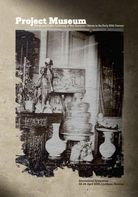 A black and white photograph of antique objects and artifacts displayed on furniture and shelves in a room, with text indicating it's from a project museum exhibition of non-European objects in the early 20th century, at an international symposium in Ljubljana, Slovenia, April 2006.