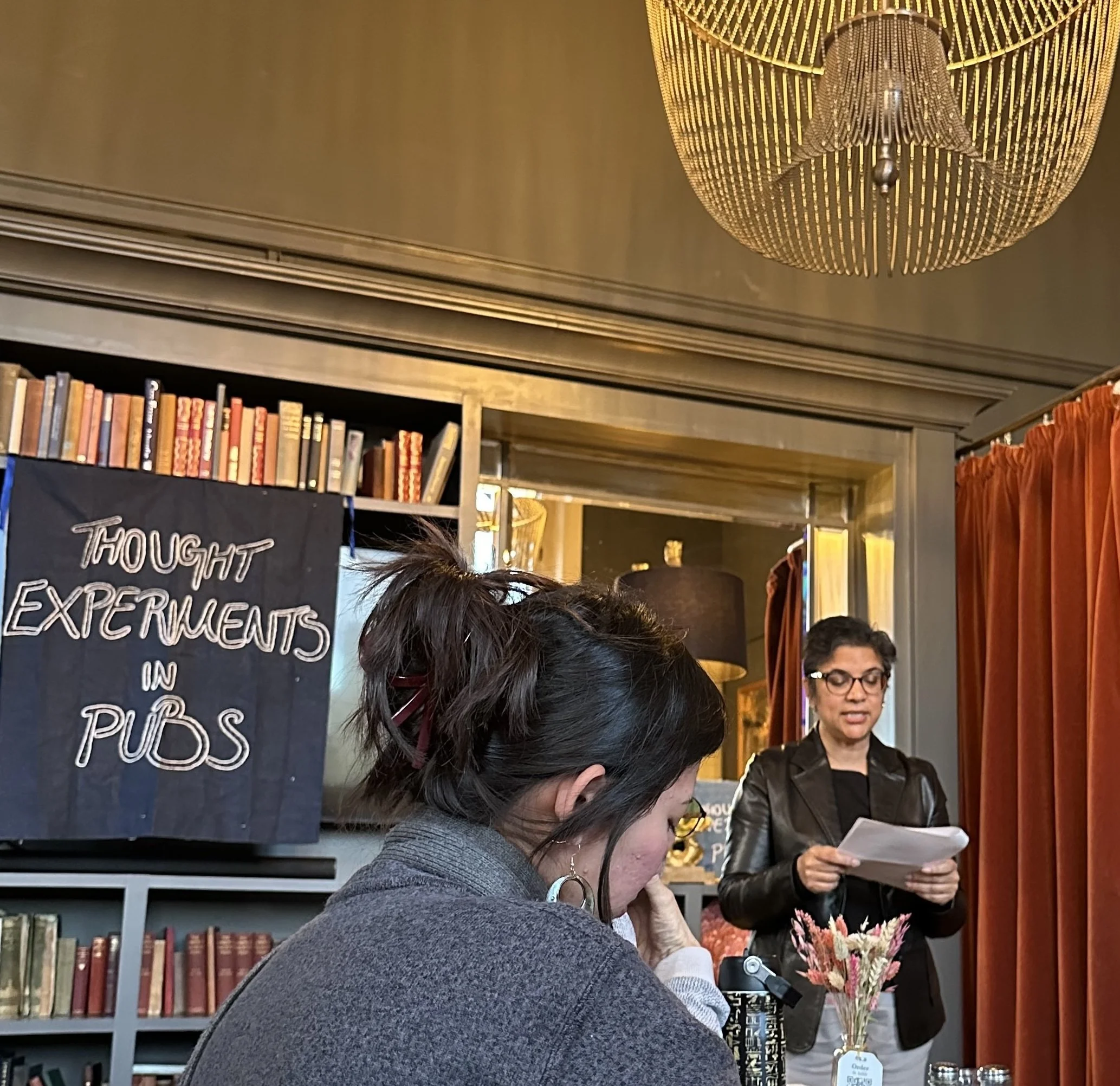 A guest author and engaged listeners at THOUGHT EXPERIMENTS IN PUBS (TEiP), the original in-person, philosophy-inspired event series focussed on thought experiments, founded in London in 2023 by Bonny Astor.