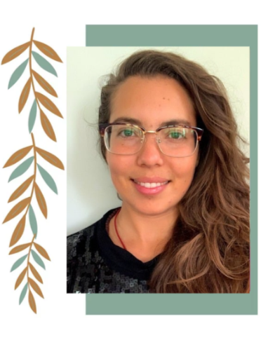 A woman with long, wavy brown hair, wearing glasses and a black shirt, smiling in front of a light-colored background with decorative leaf illustrations.