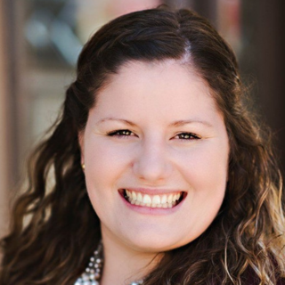 Portrait of a smiling woman with curly hair