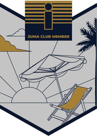 Medal I. A beach umbrella and a gold deck chair with the setting sun behind them and a palm tree at the edge.