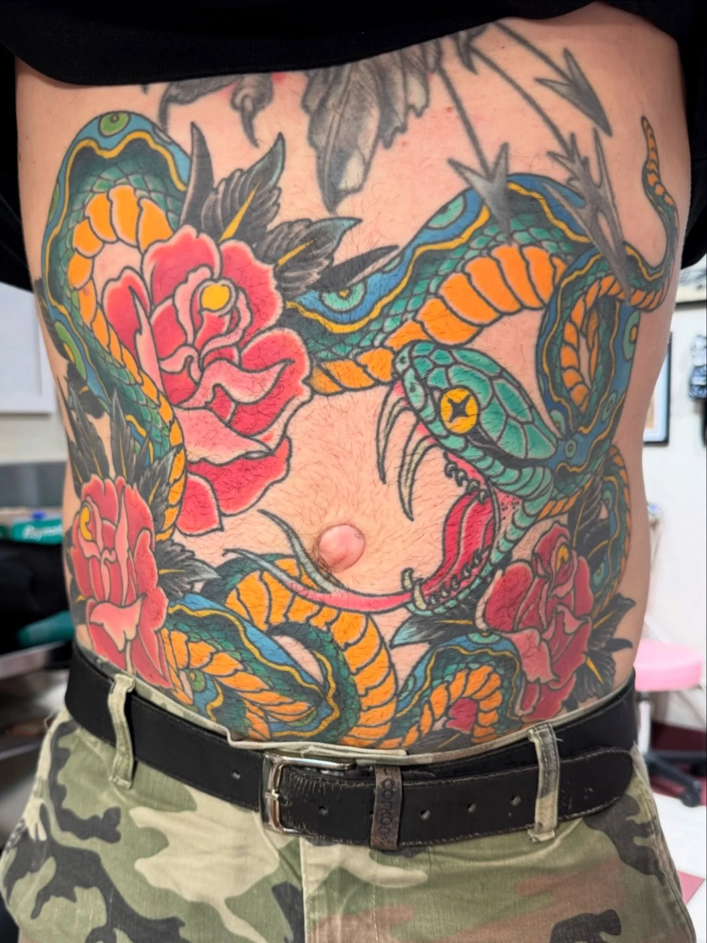 Tough as nails snake and roses stomach tattoo by @scsylvia 
Scott is in the shop Friday - Monday. The link to book in with him is in our bio!