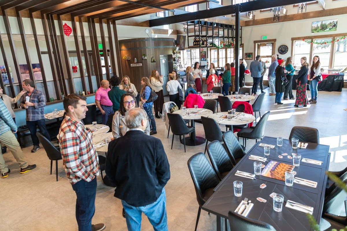 People socializing at a dinner hall.