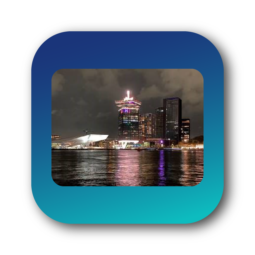 The evening reception was held in the cool, white buildinghousing the Eye Filmmuseum, next to the Sir Adam Hotel. The River Ij, pronounced "eye," is in the foreground.