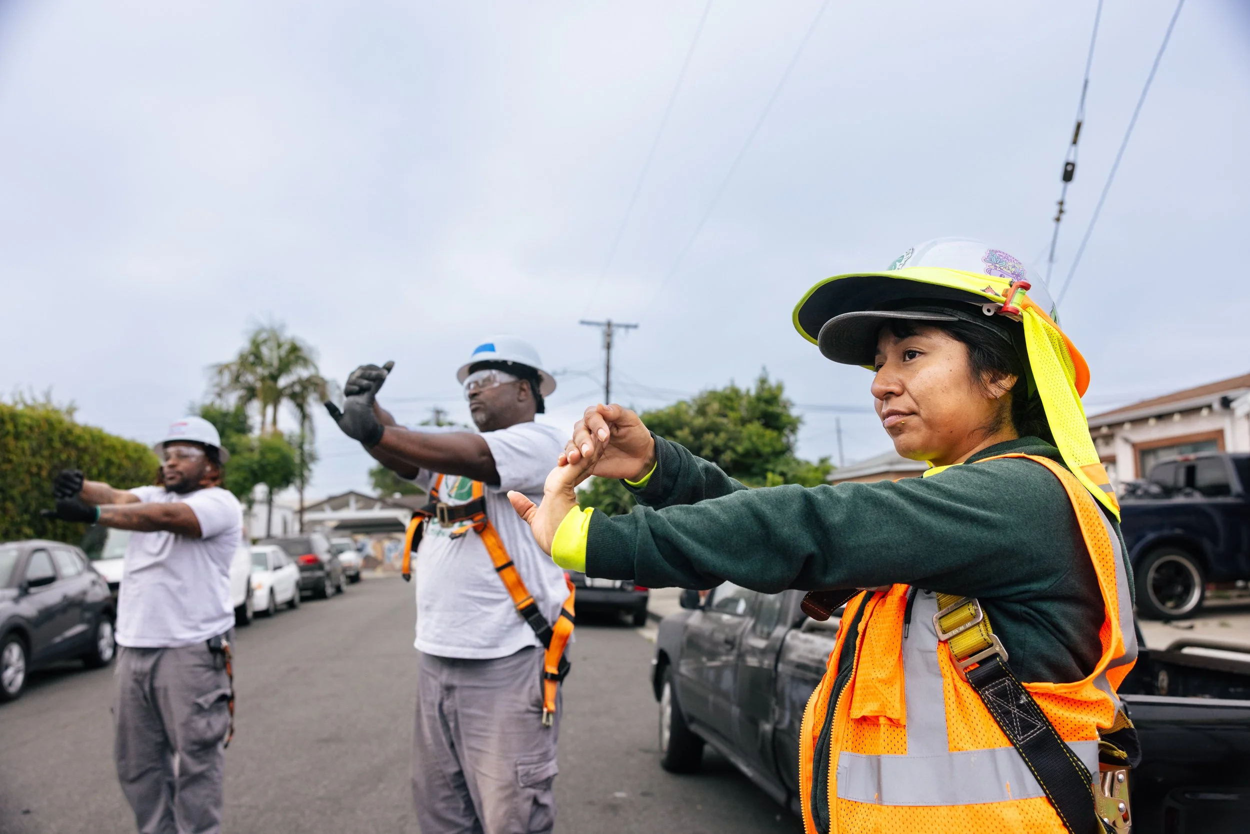 GRID Alternatives installers coordinate during a residential solar installation in Los Angeles, California.