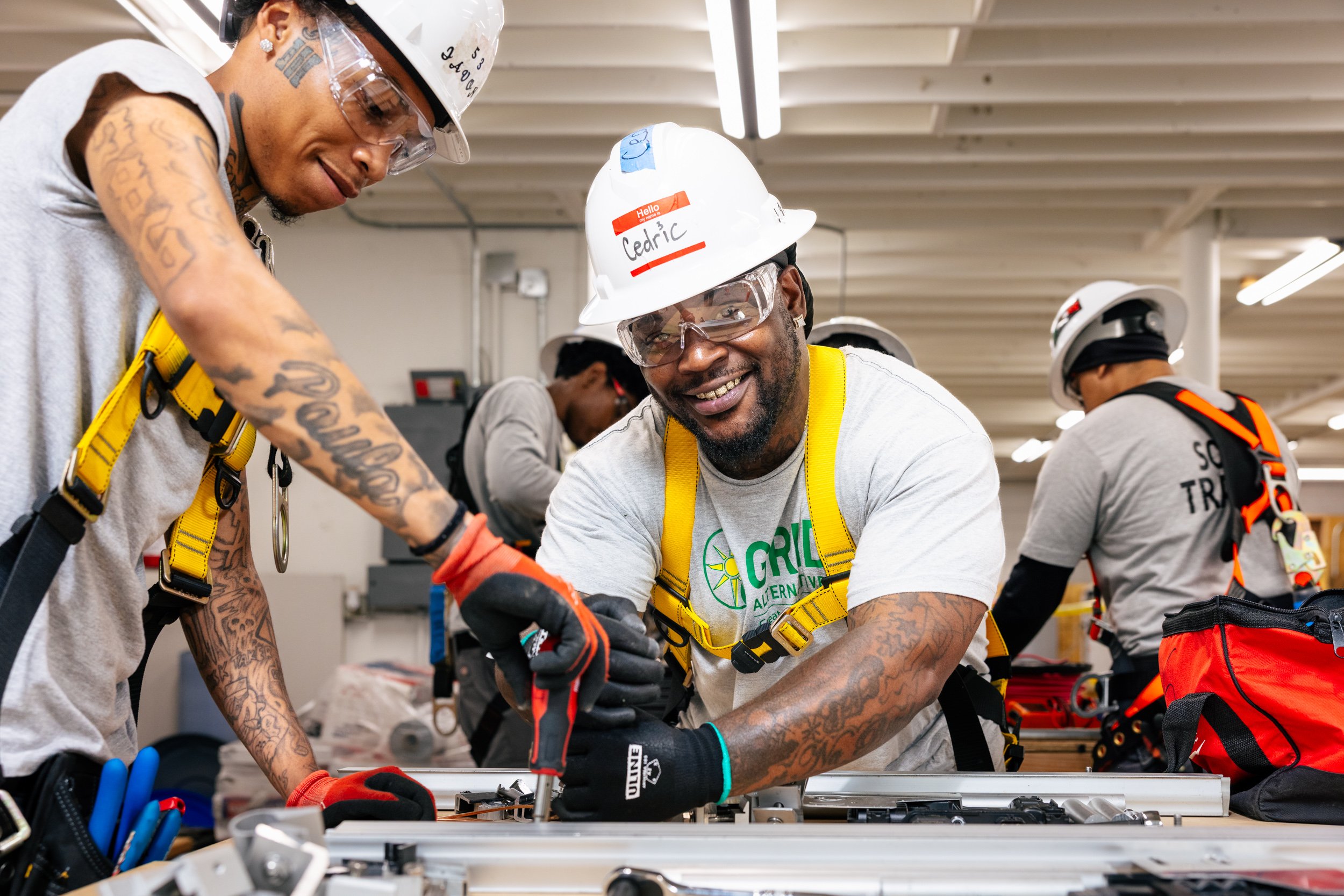 GRID Alternatives IBT 200 trainees collaborate on solar installation equipment during training in Los Angeles, California.