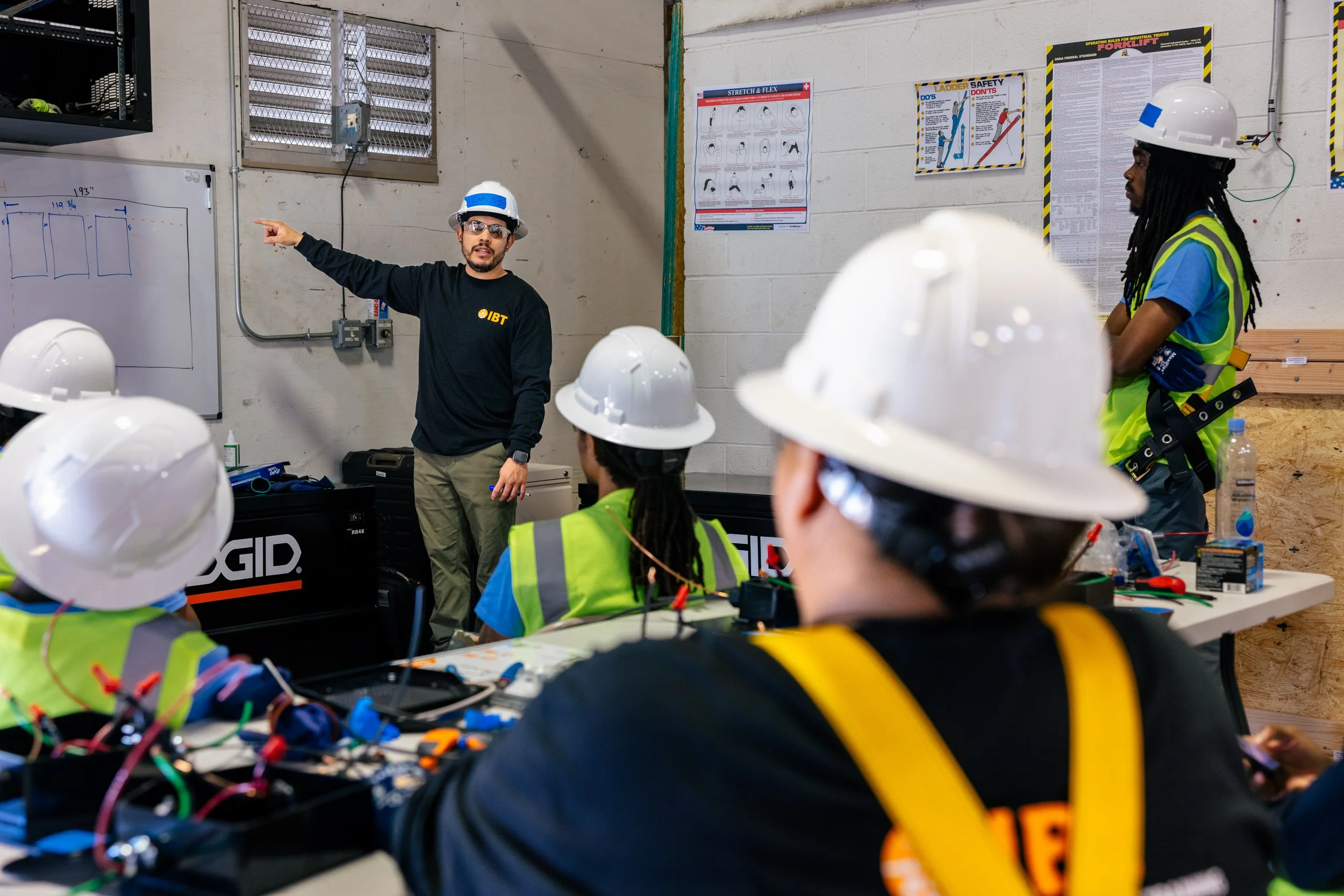 A GRID Alternatives instructor leads a classroom session during IBT 200 solar installation training in Los Angeles, California.