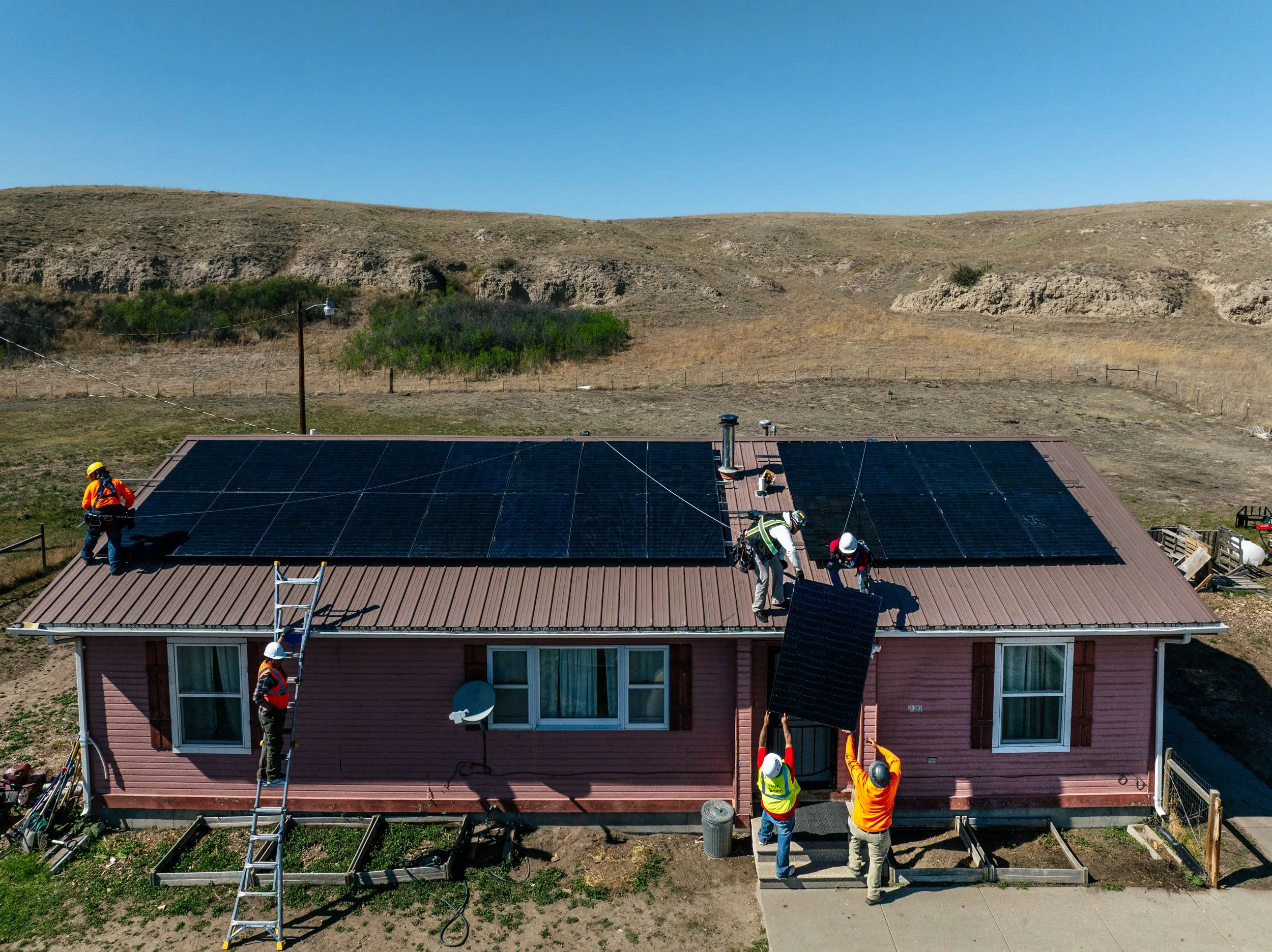 A completed residential solar installation on a home at the Pine Ridge Indian Reservation, South Dakota, installed through GRID Alternatives' Tribal Energy Alternatives program.