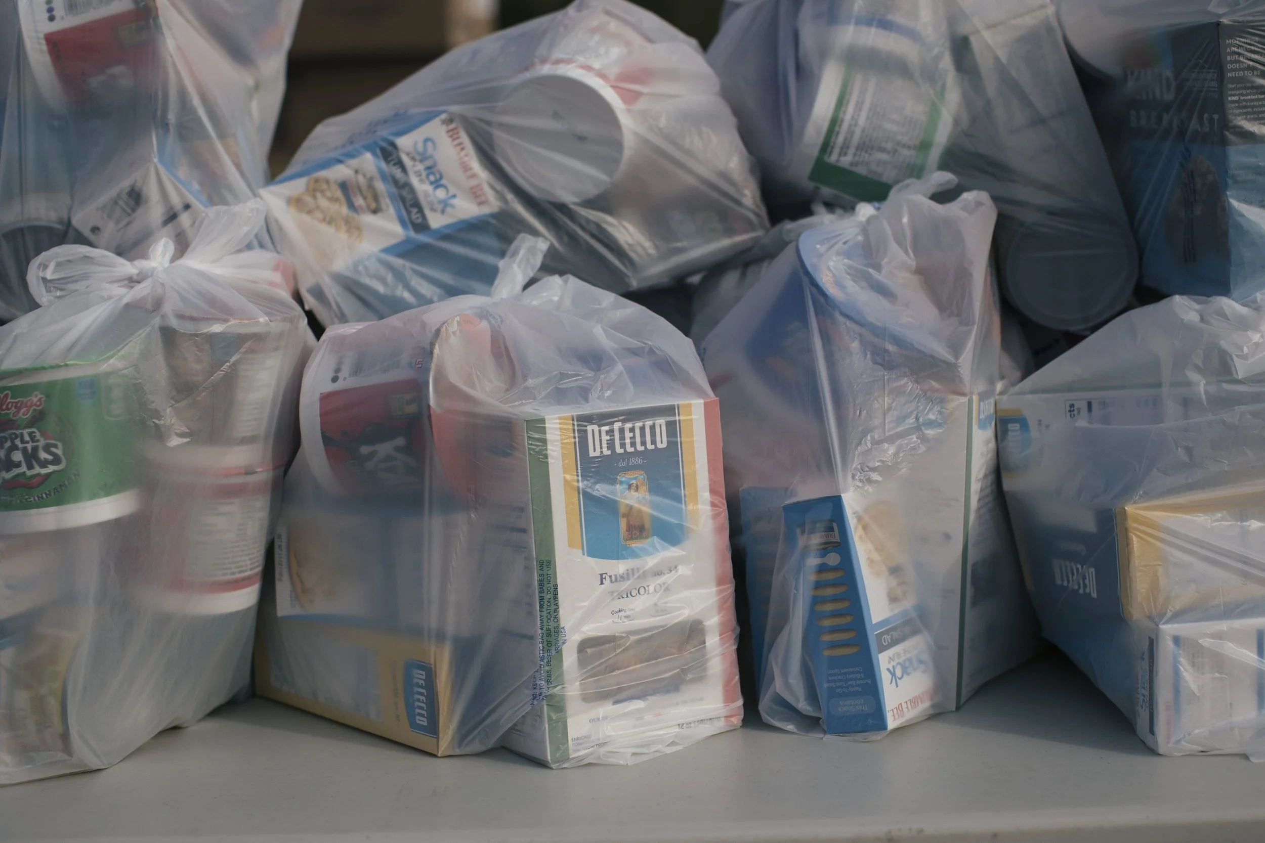 Bags of food -- including pasta -- are ready to be distributed at a food pantry. Washington, D.C.-based photographer, videographer and writer, newspapers, magazines, nonprofits, NGOs, foundations and corporations. Advertising, marketing.
