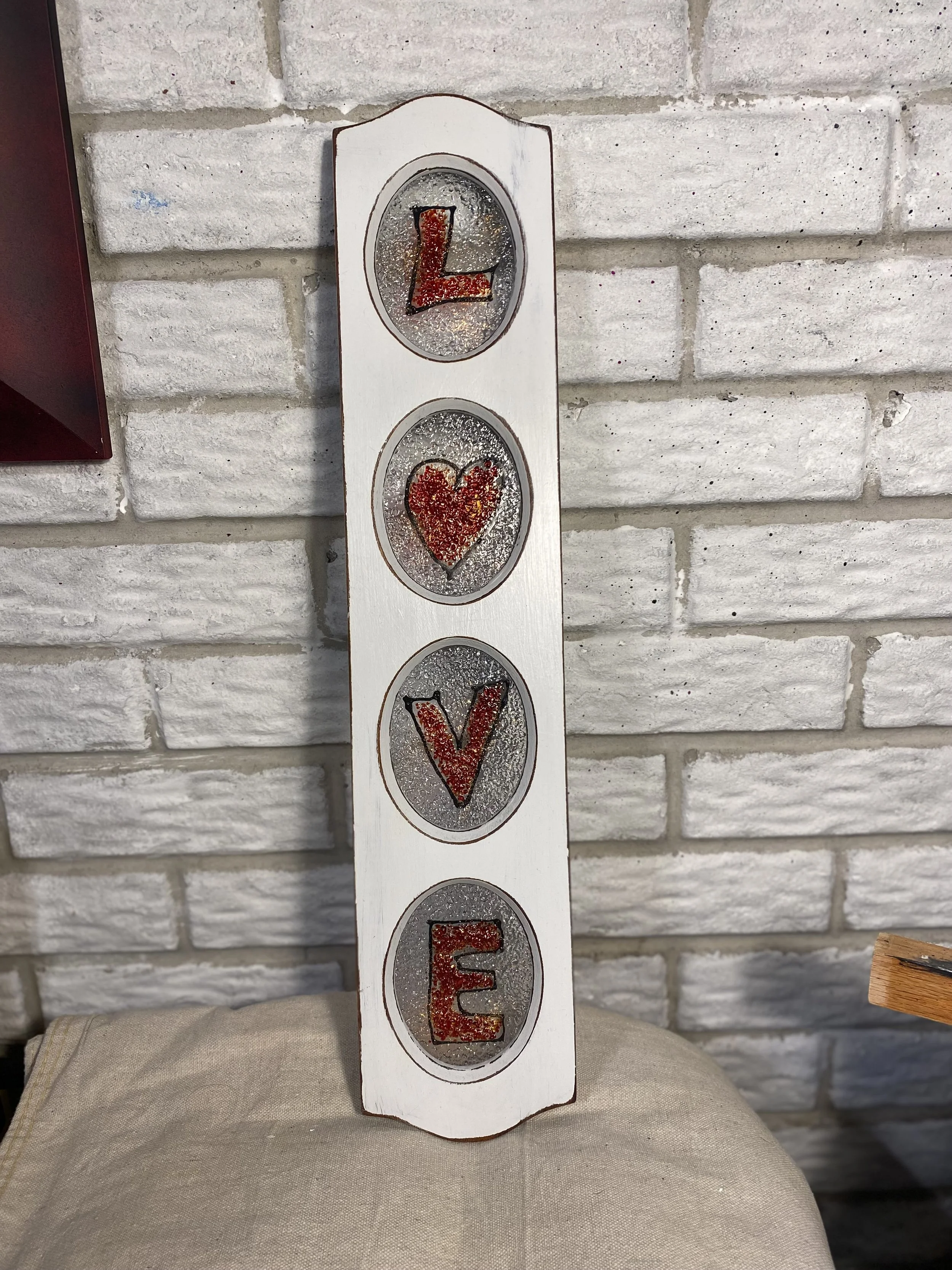 Love - Glass fusion in frame. 23 x 7. $70