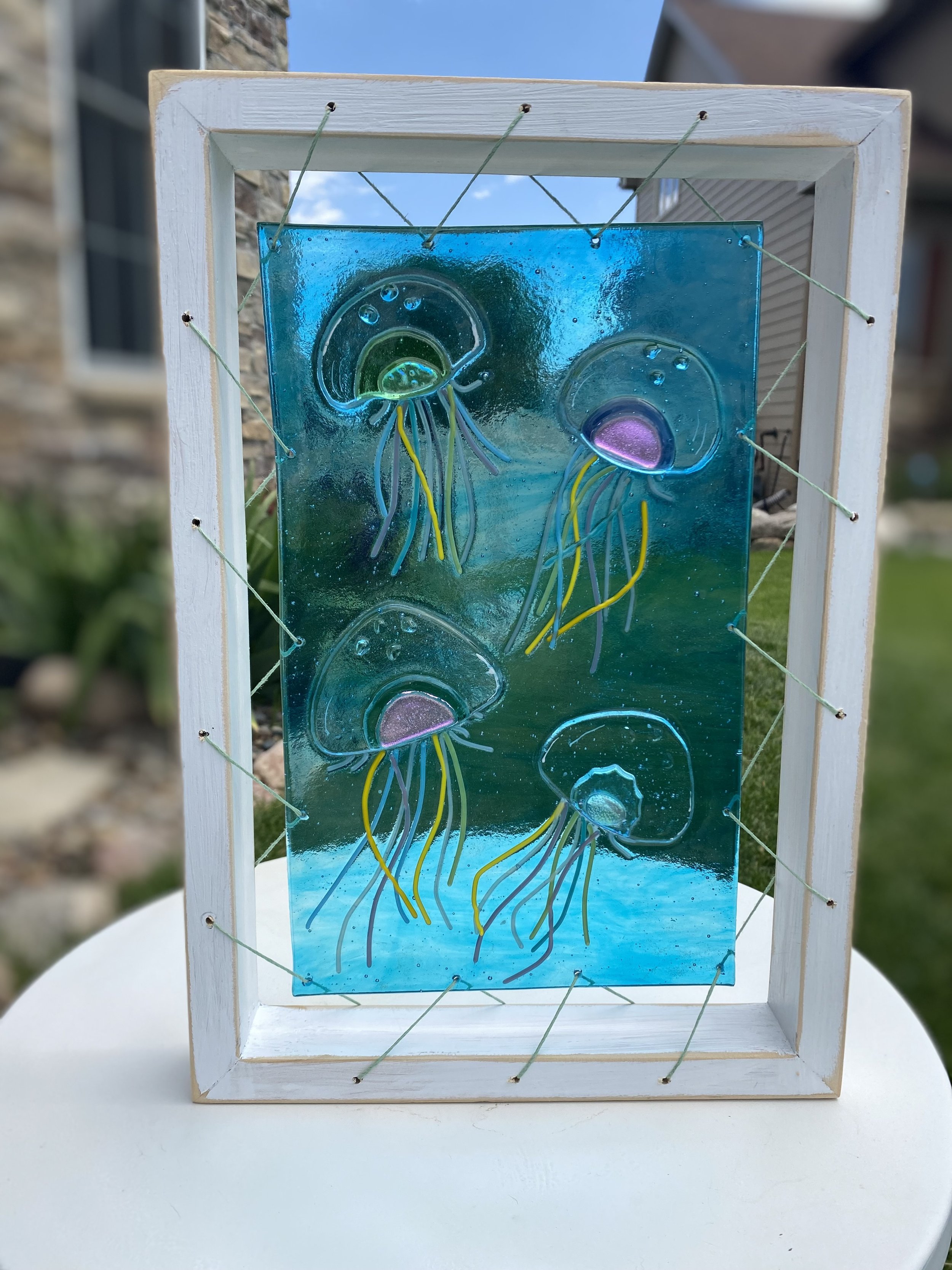 Jelly Fish - glass fusion in signature frame. 10 x 14.5 $ 100