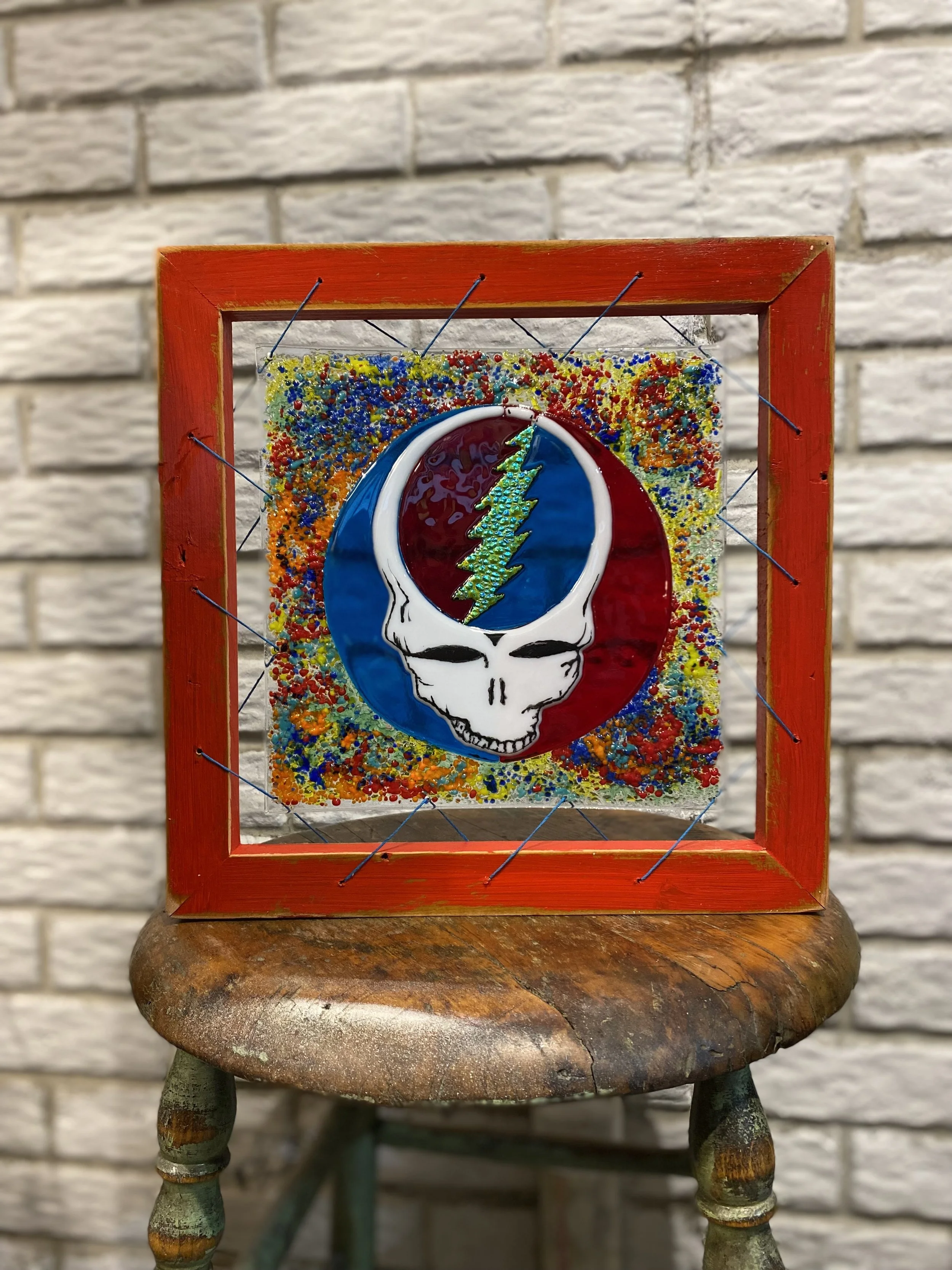 Dead Head -  Fused Glass With My Custom Framing . Glass is 10x10 with frame 13x13 
$100