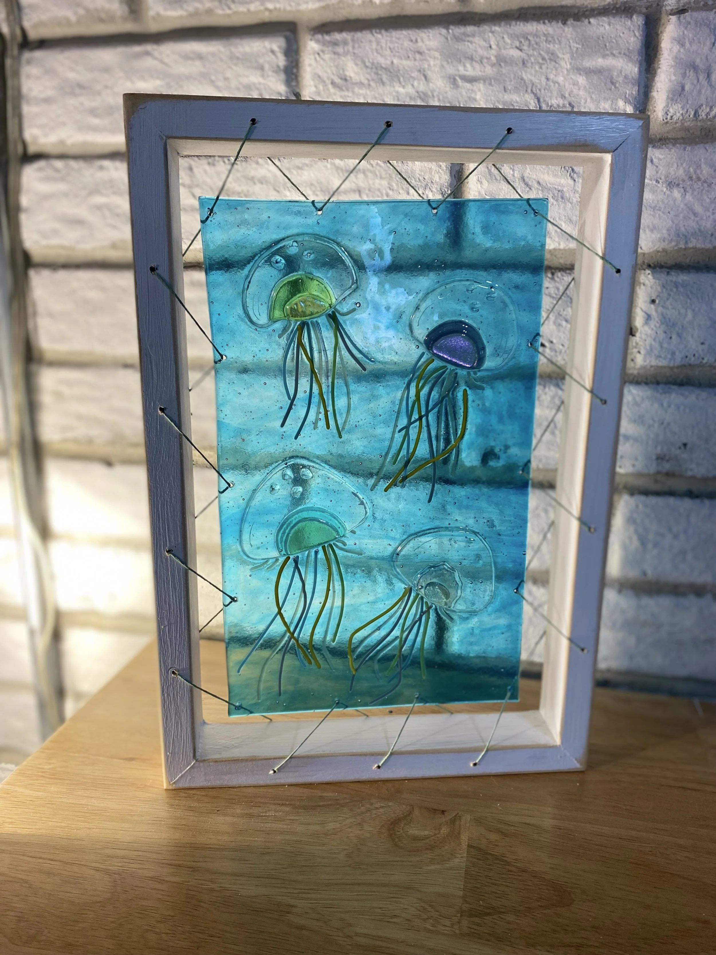 Jelly Fish - glass fusion in signature frame. 10 x 14.5 $ 100