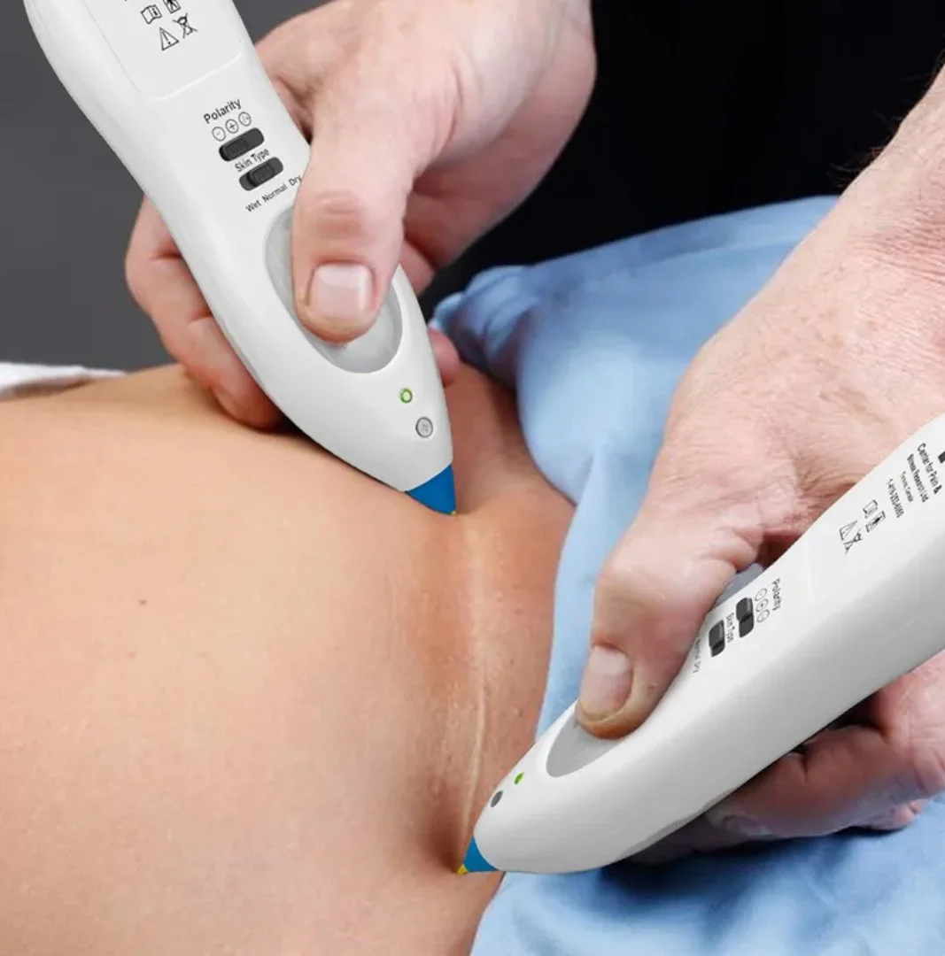 Close-up of a healthcare professional using ultrasound devices on a patient's abdominal area.