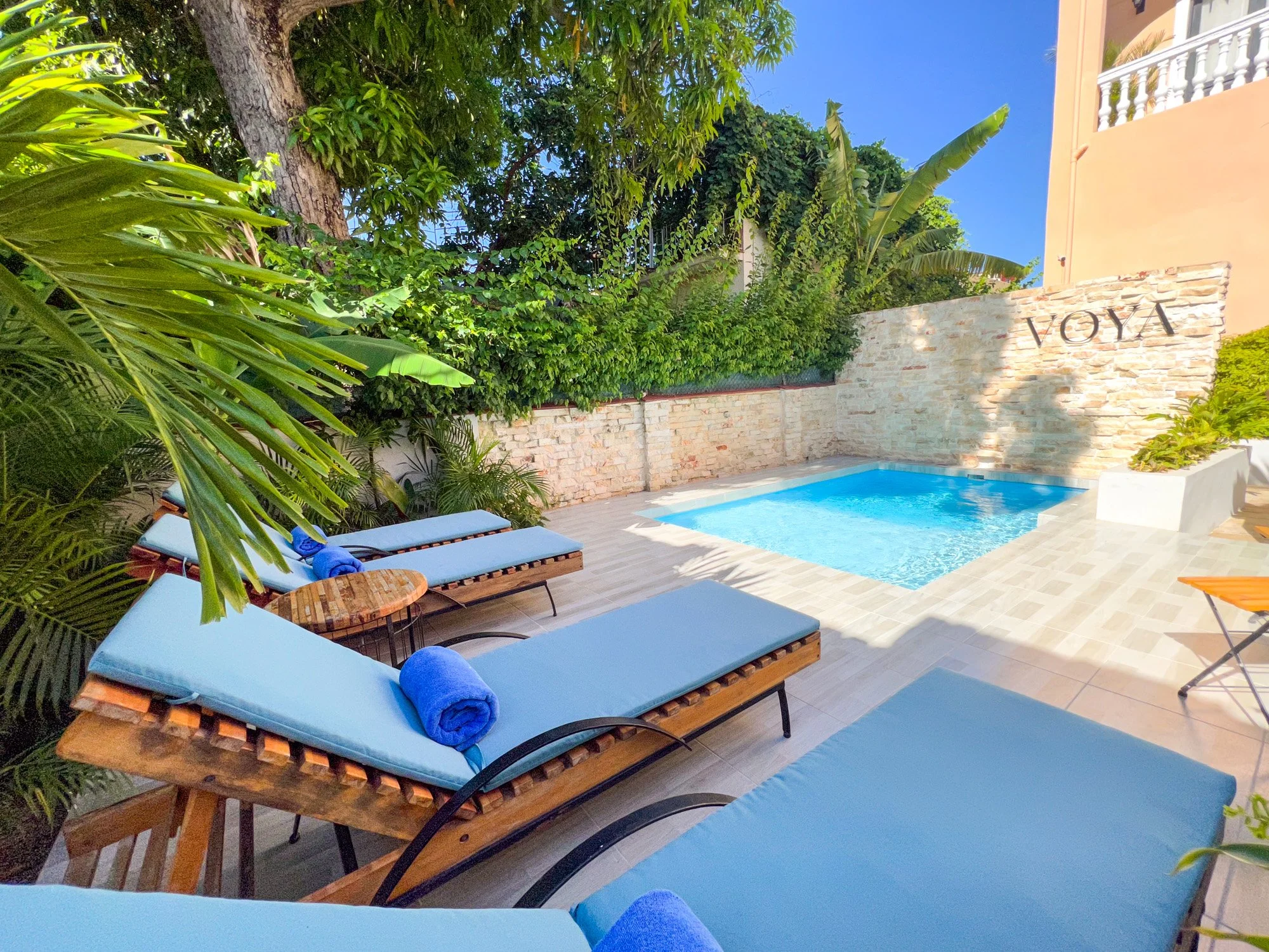 Heated outdoor pool with sun loungers at VOYA Boutique Hotel Havana