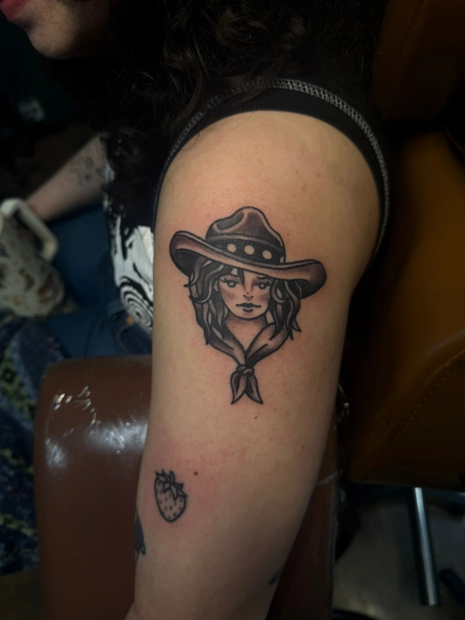 Traditional tattoo of a cowgirl in black and gray ink by Leah Fries, located at Moth to a Flame Tattoo, Colorado Springs